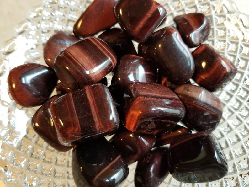 Many pieces of red Tiger Eye stones