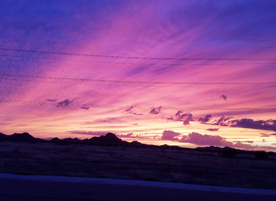 A sunset sky of vibrant blues, purples and pinks