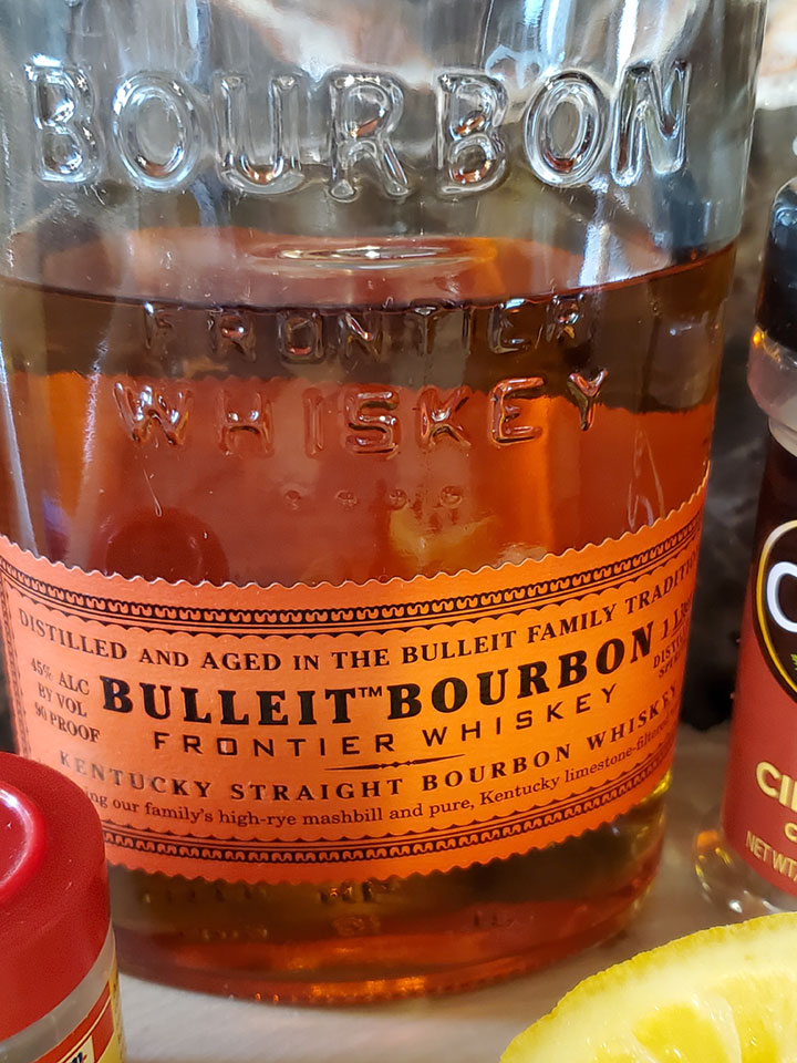 A bottle of half drank Bulleit Bourbon
